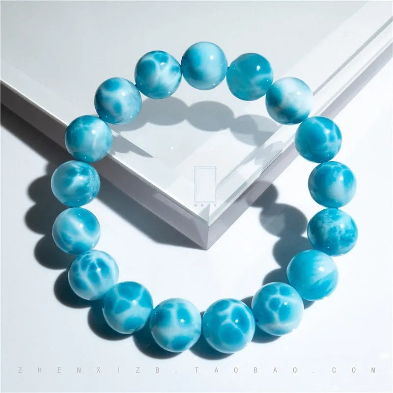Blue Bodhi bracelet with sea-pattern crystal beads and pearl accents in Maillard style on wrist