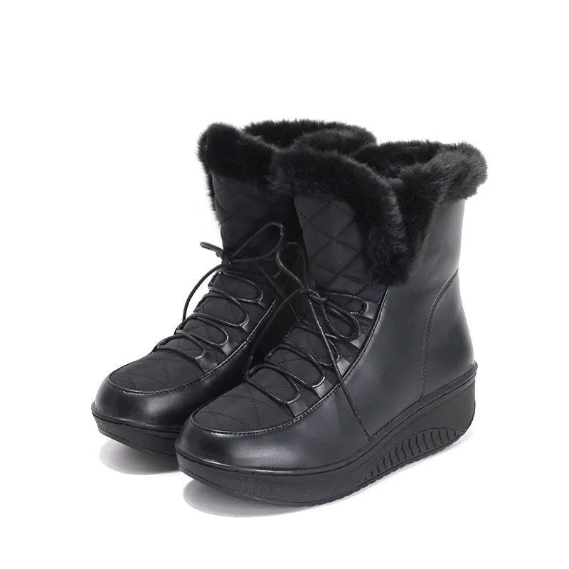 Black women's lace-up winter boots with a platform sole on a white background.