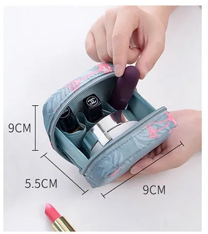 A cube-shaped cloth makeup storage bag available in blue, pink, white, and white pink colours.