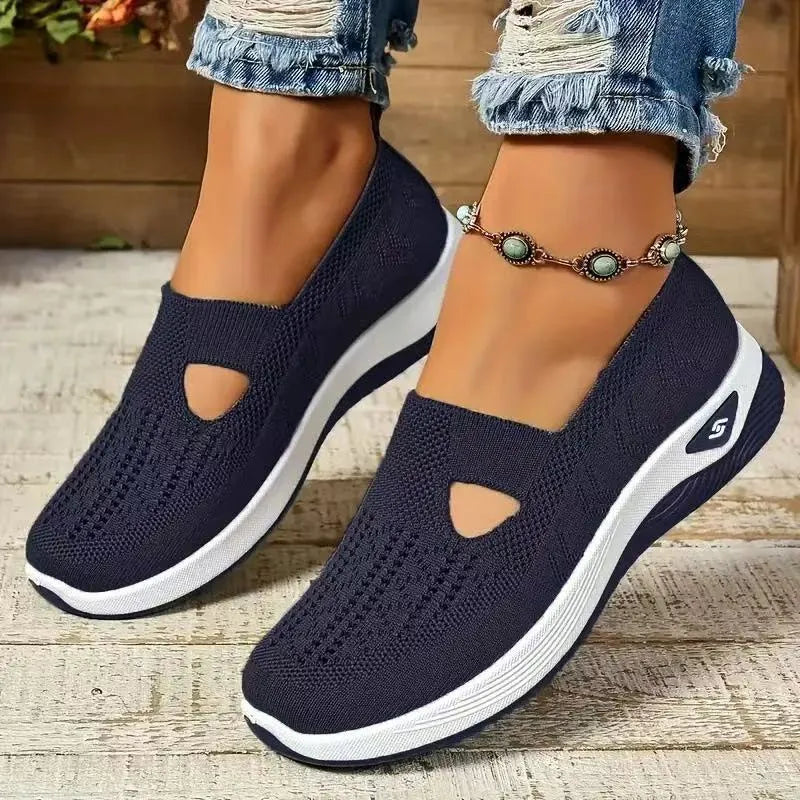 Elderly woman's black mesh T-strap shoe with soft PVC sole and round toe