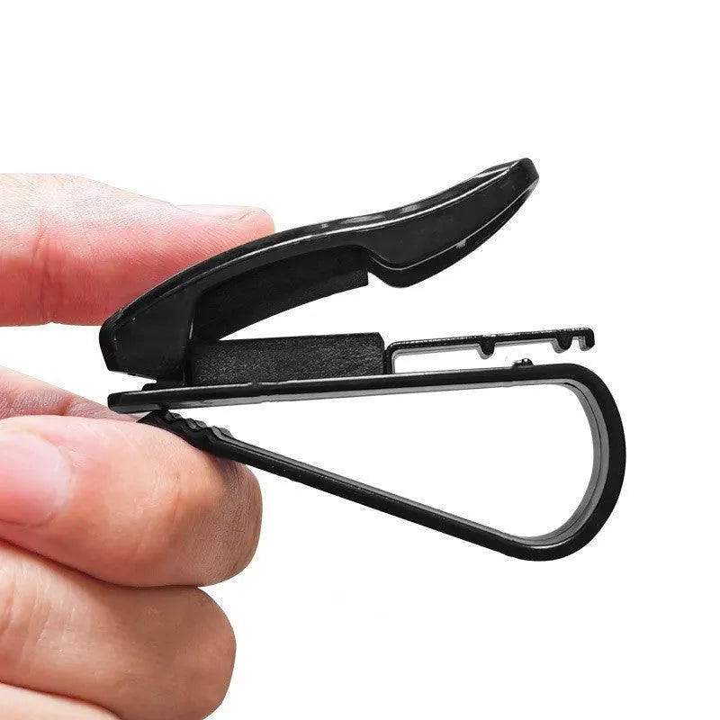 Black plastic clip holder for car sunshade to hold glasses, ID cards, and tickets.