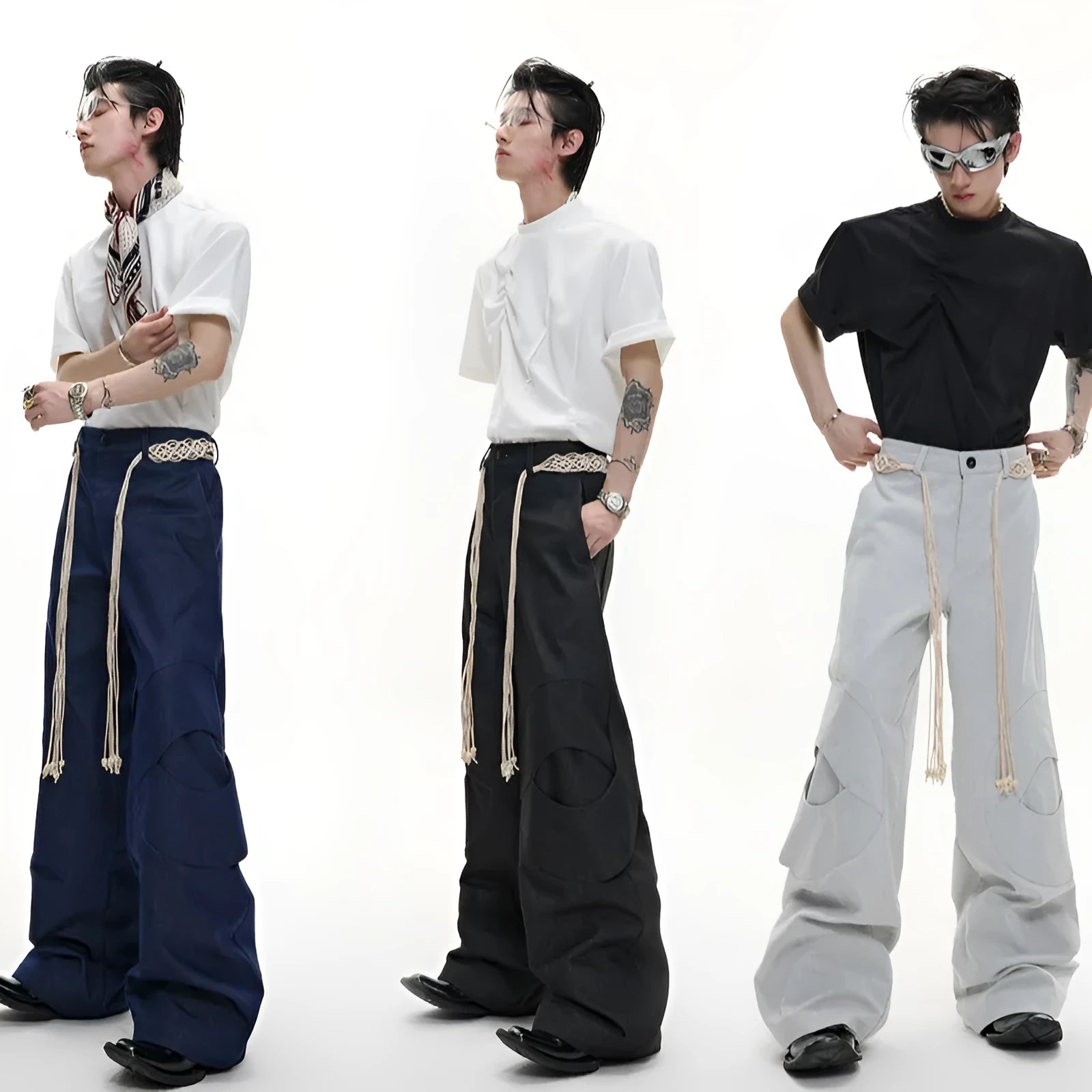 Men's dark blue straight-leg cotton jeans with 3D cutting, belt stitching, and decorative pocket tassels.