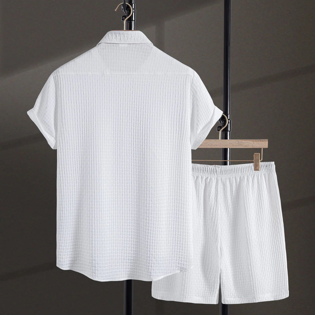 Men's black cotton blend short sleeve shirt and matching shorts set displayed together