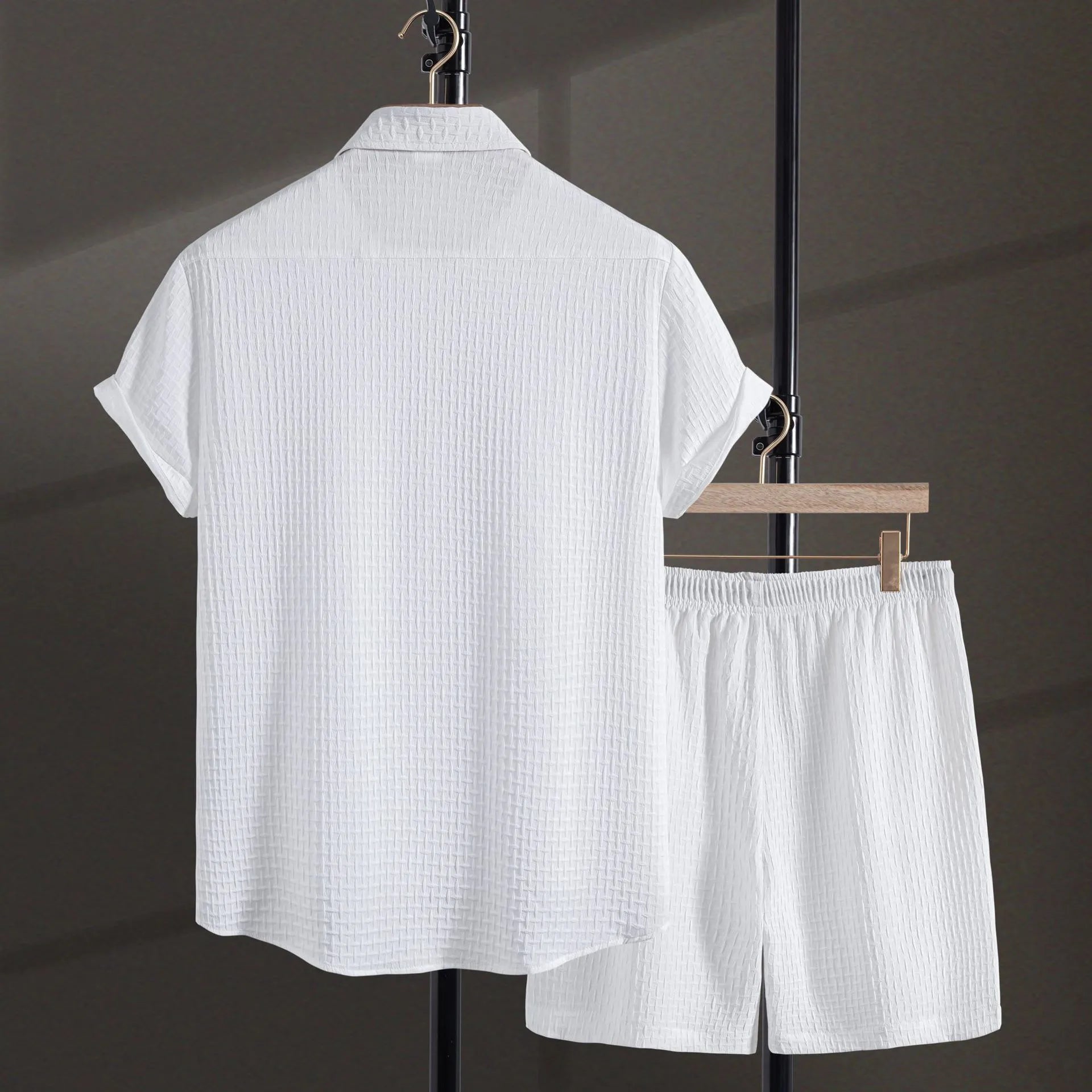 Men's black cotton blend short sleeve shirt and matching shorts set displayed together