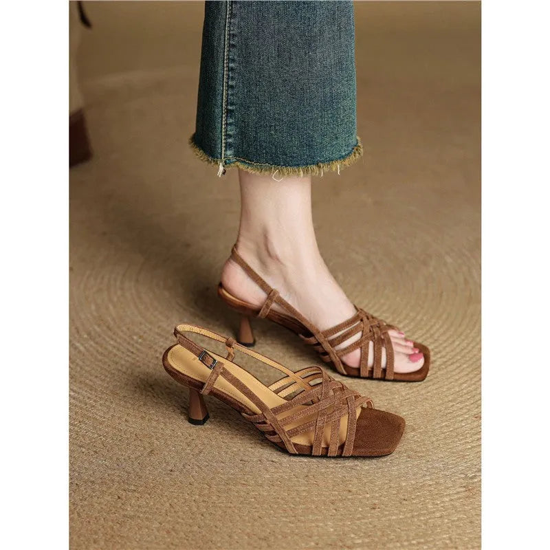 Light brown women's retro sandals with thin cross straps, ankle buckle, and a square toe on a mid heel.