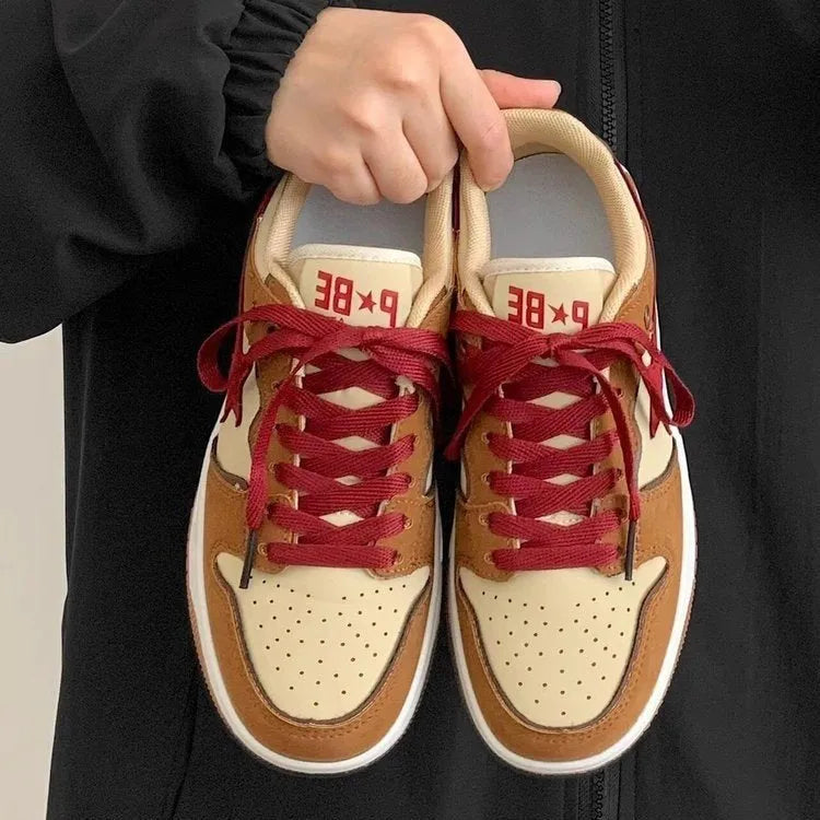 Brown women's low-top platform sneakers with sequin details and a lace-up front.