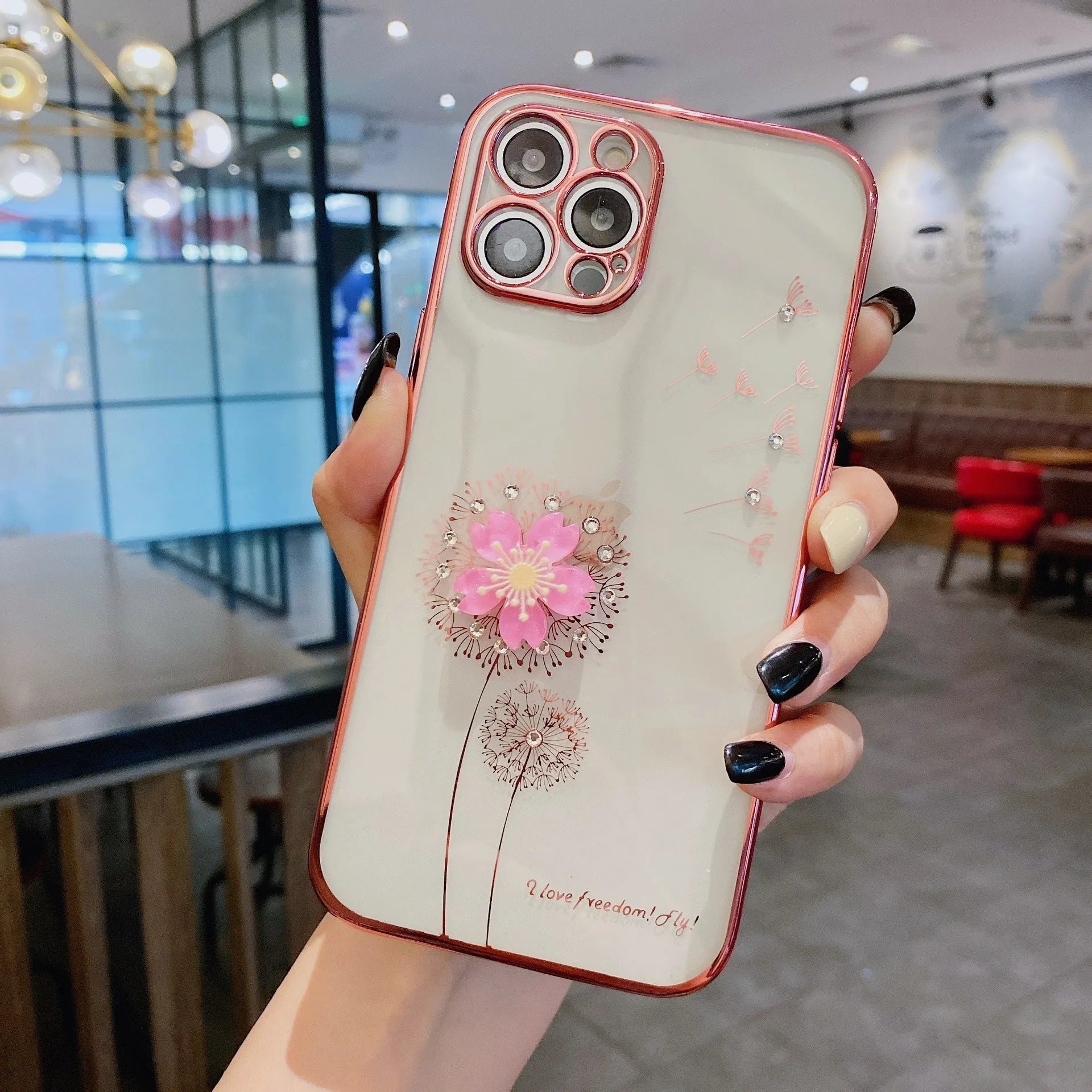 Green silicone iPhone case with a 3D floral design and a built-in spin stand on a white background.