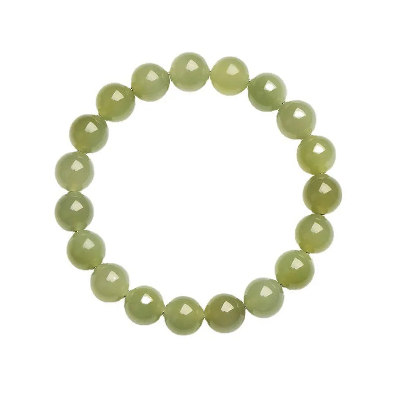 Polished Hetian jade ball bracelet on a wrist, showing ice-like clear beads in one of four available sizes.