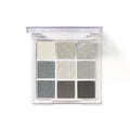 Smoked design nine-colour eyeshadow palette showing shades of white, silver, black, and iron grey.