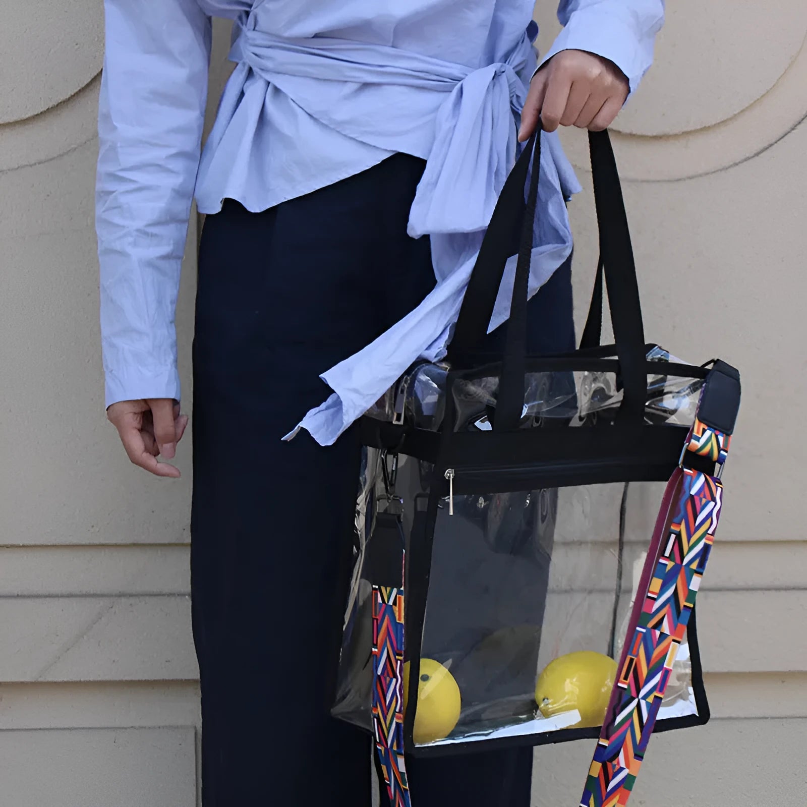 Women's transparent PVC messenger bag with crossbody strap and three-dimensional front pocket.