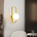 Minimalist wall lamp with glass shade and iron body in black or gold finish