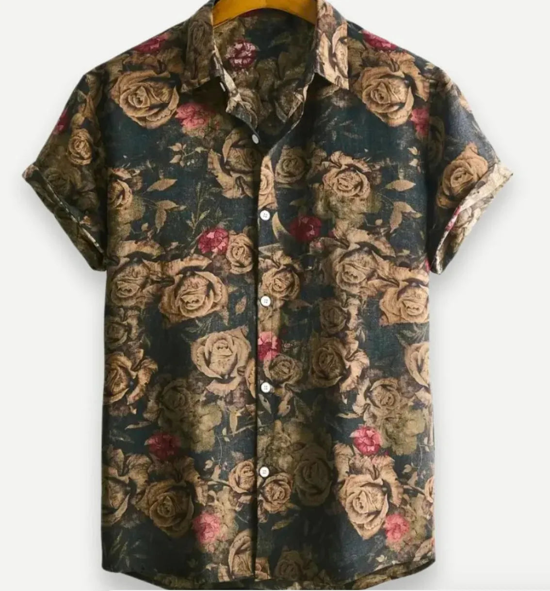 Man wearing a short sleeve lapel collar Hawaiian shirt with a blue floral print.
