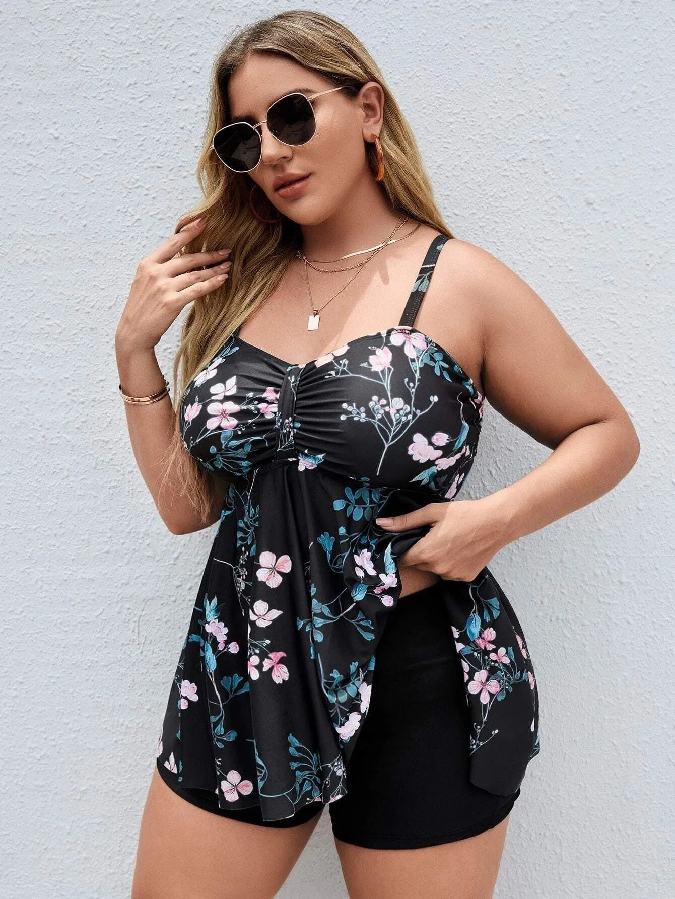 Women's floral print one-piece swimsuit showing split colour design and high elasticity fabric