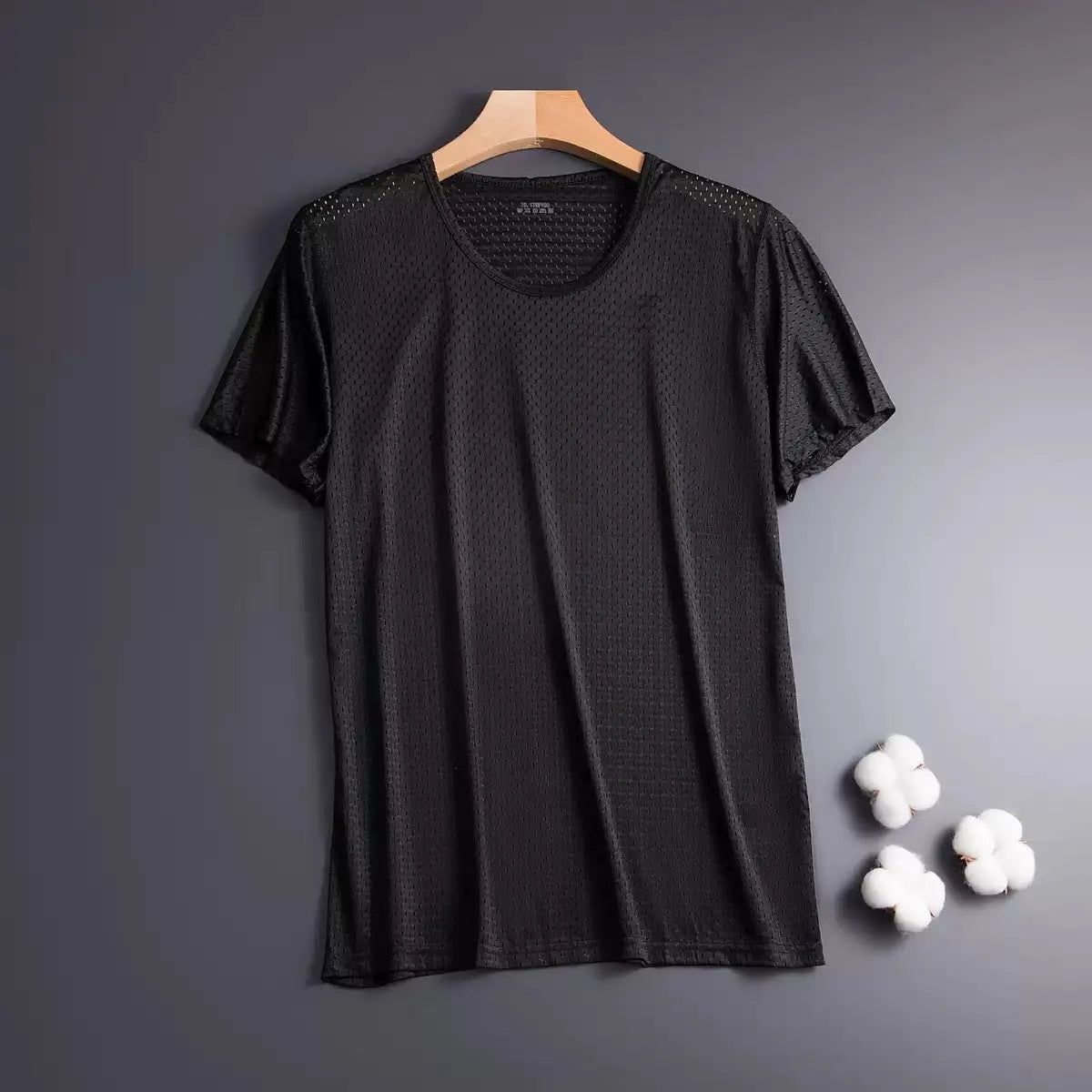 Man wearing a solid colour ice silk short sleeve crew neck T-shirt in a loose fit.