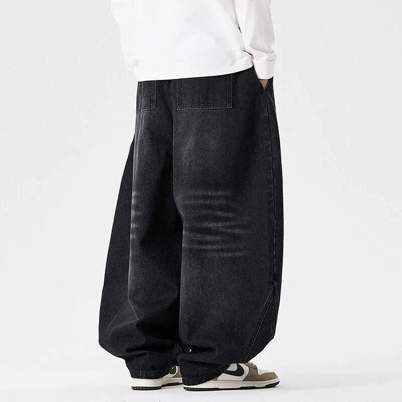 Men's plus-size light blue baggy jeans with a straight leg and zip fly