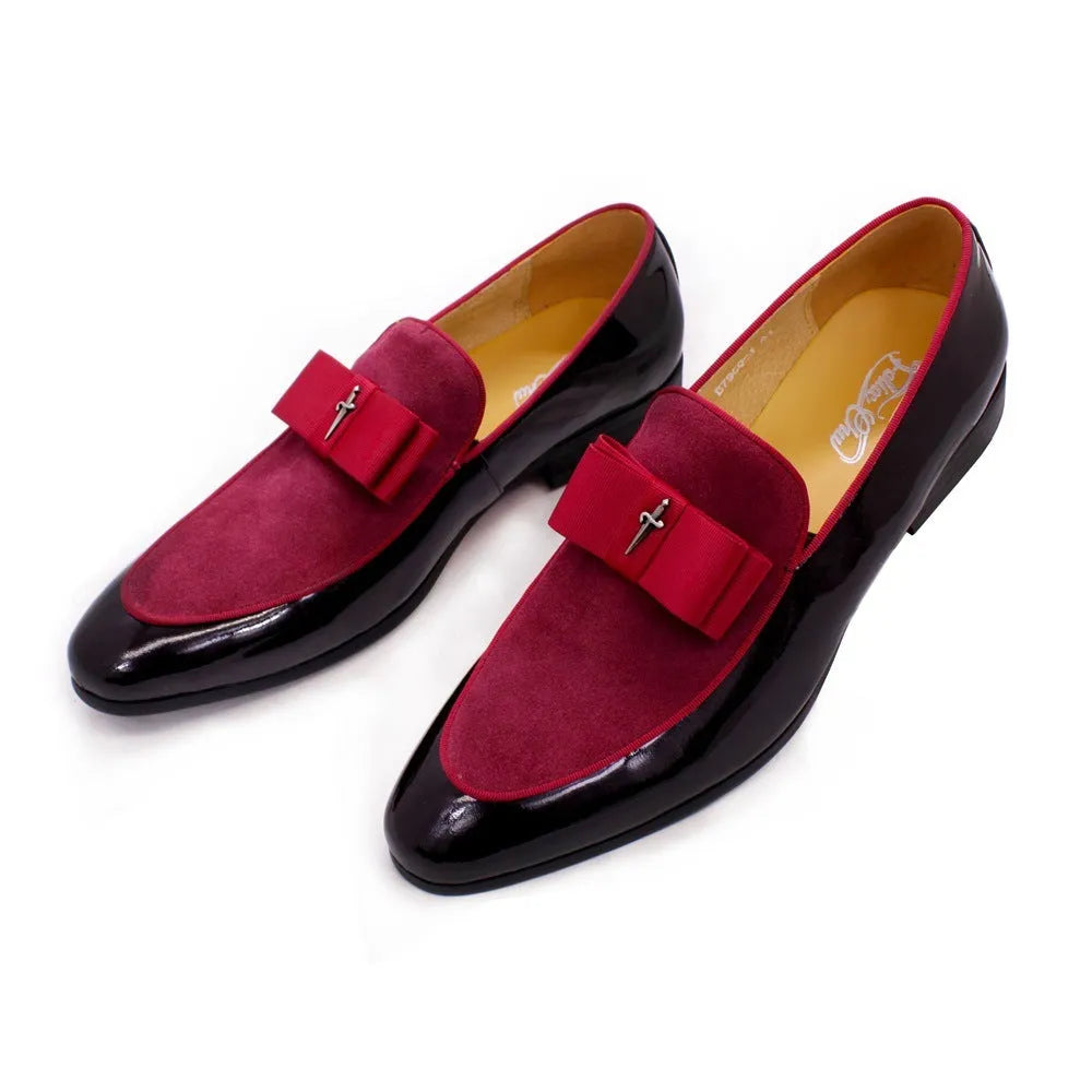 Men's black patent leather low-top dress shoes with a tassel detail on the front.