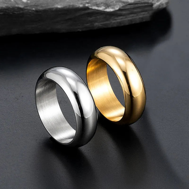 Glossy electroplated titanium steel ring in gold, black, and steel colours showing band detail