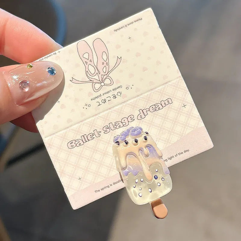 Resin hair barrette featuring a cartoon ice cream design in pink, red, coffee, purple, and beige colour options.