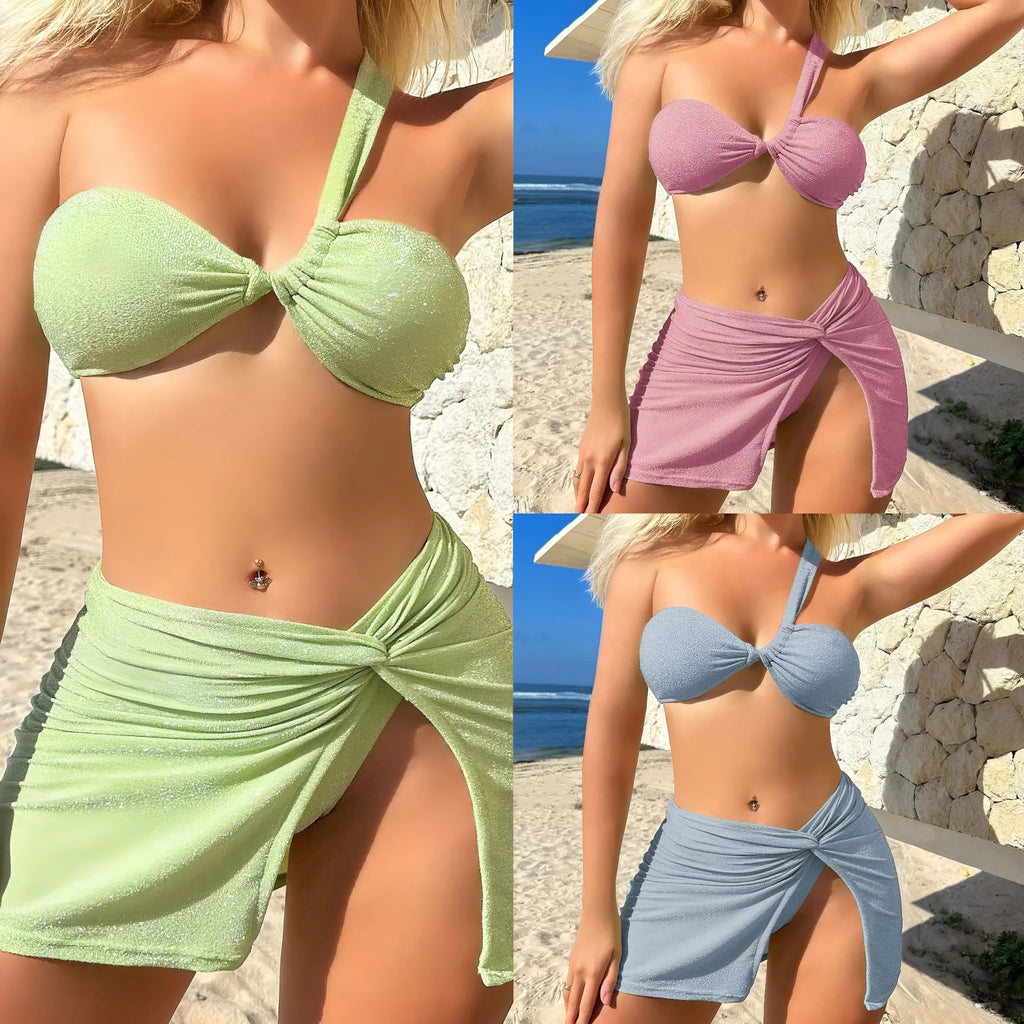 Light green one-shoulder tube top swimsuit set with matching pants and skirt on a mannequin