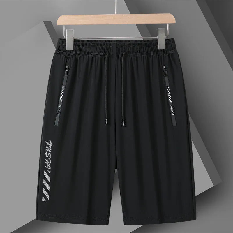 Men's black nylon quick-drying sports shorts with elastic waistband, shown in loose fit.