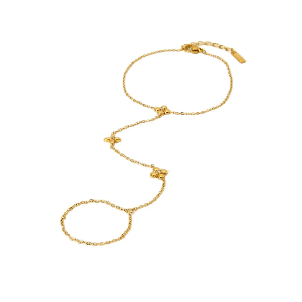 Gold-tone stainless steel women's bracelet with an eight-pointed star and floral geometric design