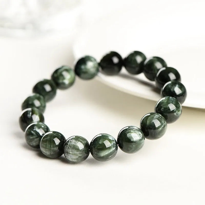 Green Dragon Crystal bracelet with round beads and ruyi design element.