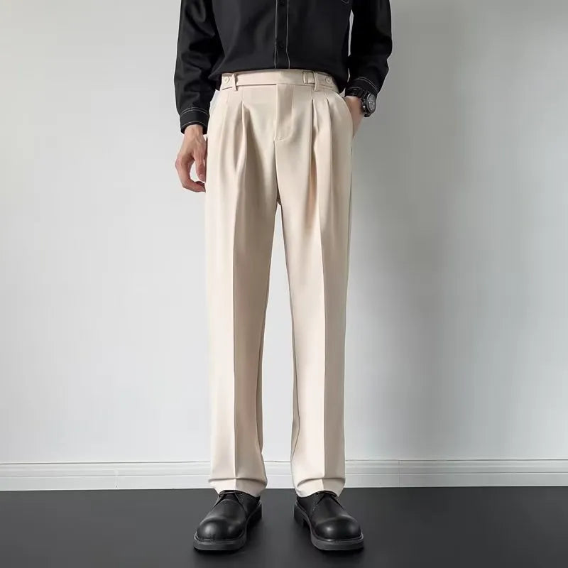 Men's straight-leg loose fit suit trousers in apricot colour on a hanger.