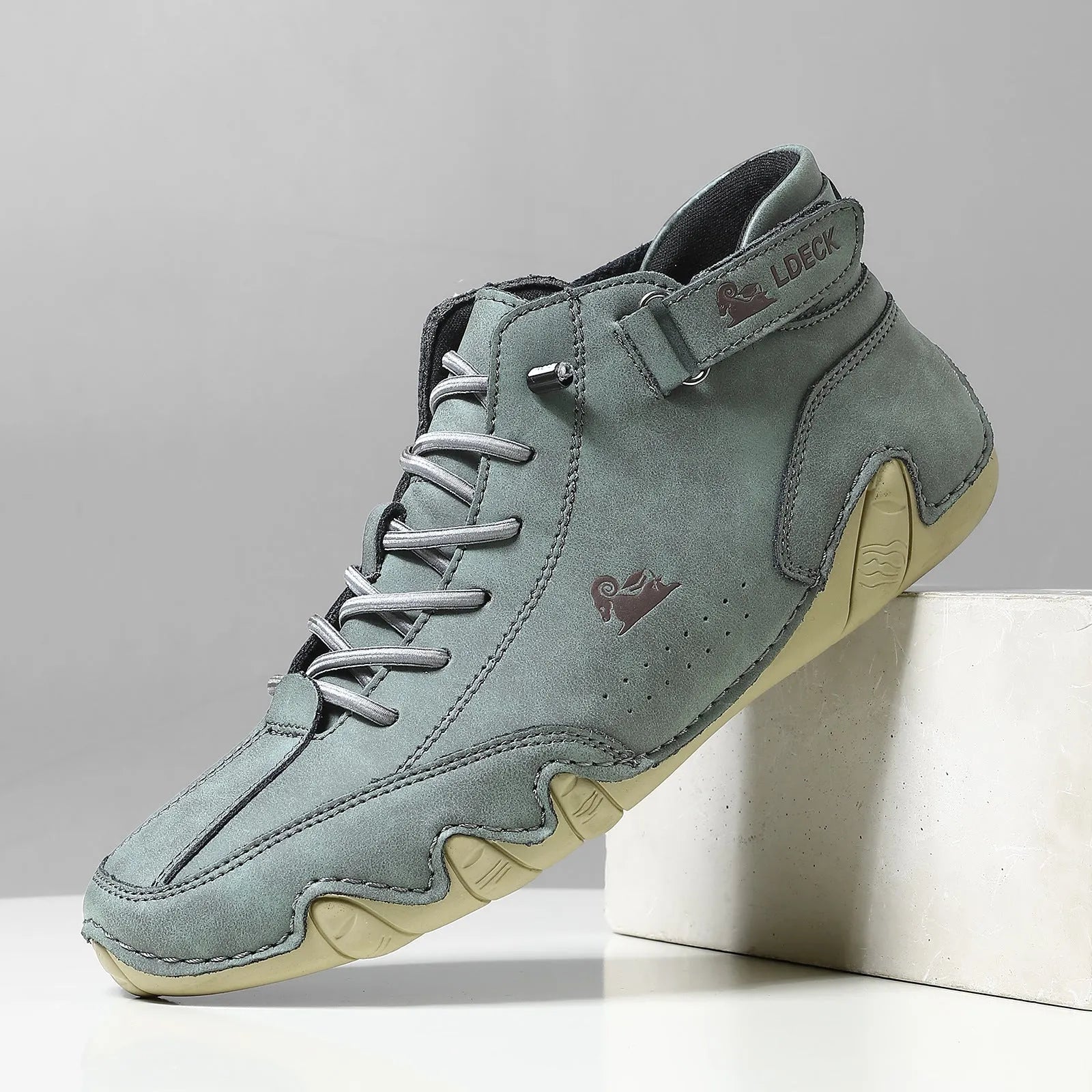 Men's khaki Octopus high top boots with microfiber upper, rubber sole, and pigskin boot tube on a white background.