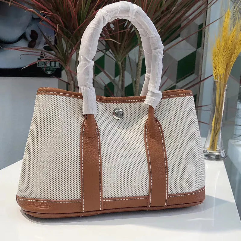 Genuine leather crossbody bucket tote bag with canvas surface in multiple colour options