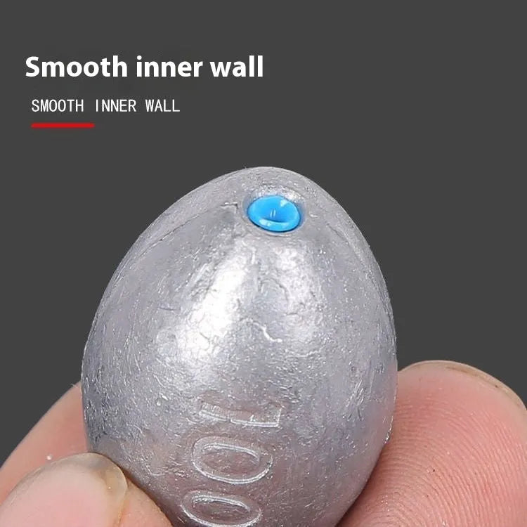Olive lead sea fishing sinker with plastic core and scale texture, shown with weight options from 10 to 150 grams.