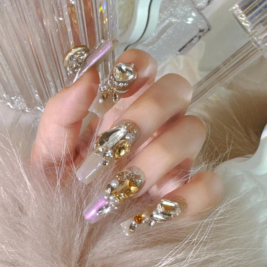 Artificial nail kit with rhinestone designs and phototherapy sealing layer on card packaging