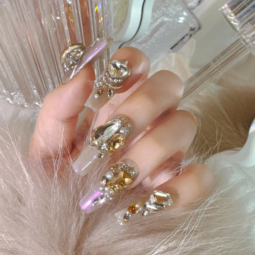 Artificial nail kit with rhinestone designs and phototherapy sealing layer on card packaging