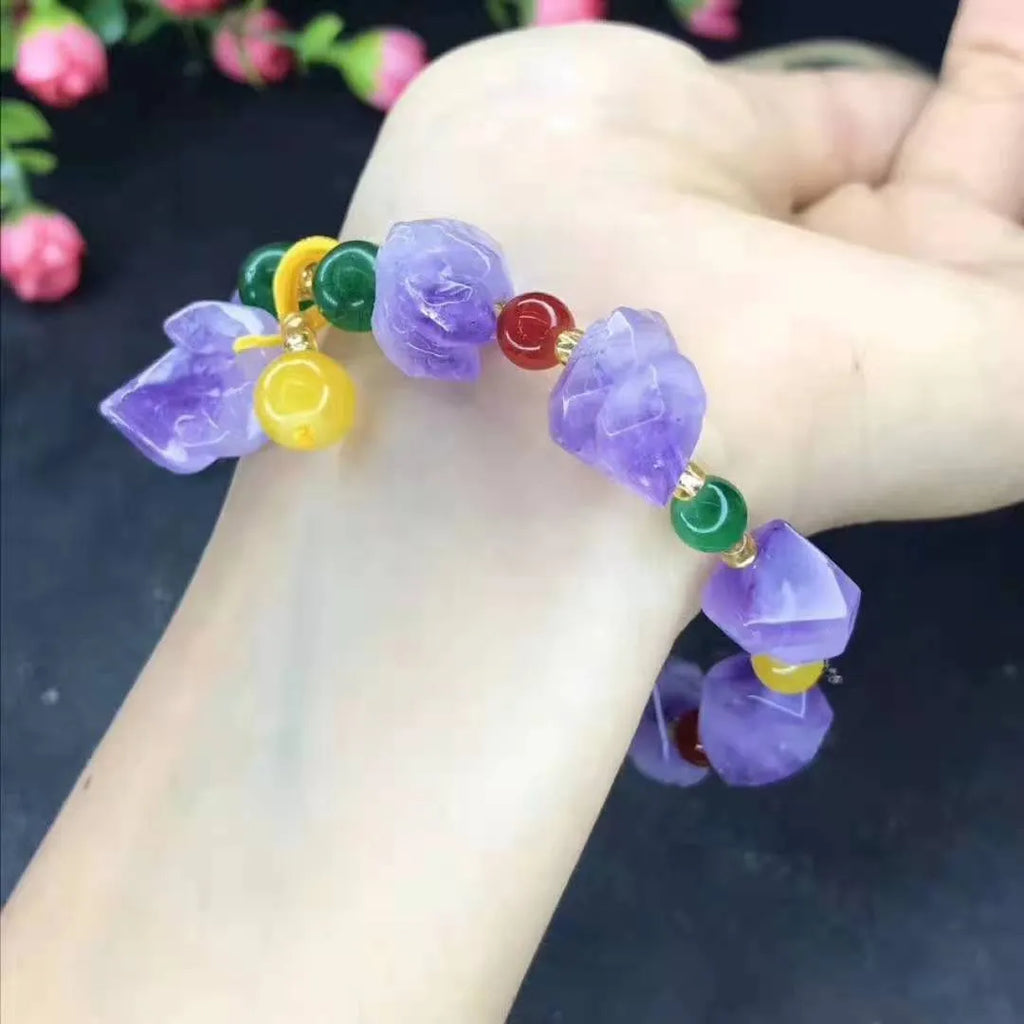 Women's natural amethyst shaped bead bracelet with a fu character charm.