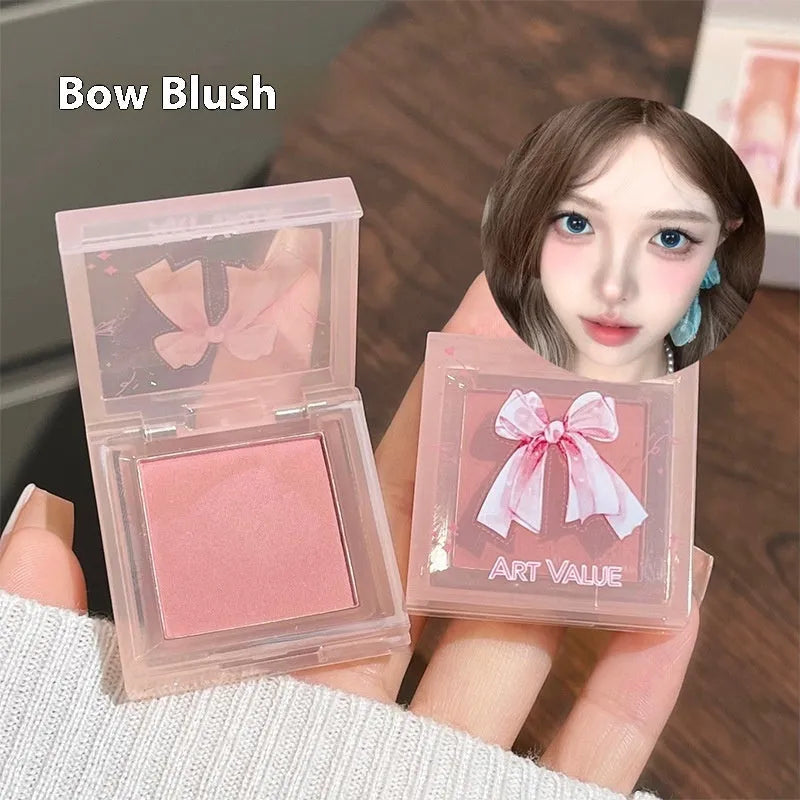 Butterfly Box cosmetics set showing four matte lip muds, pink powder blusher and necklace