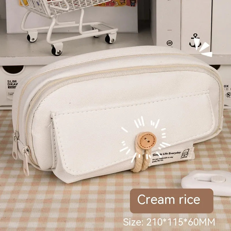 Korean style canvas pencil case in green holding multiple pens