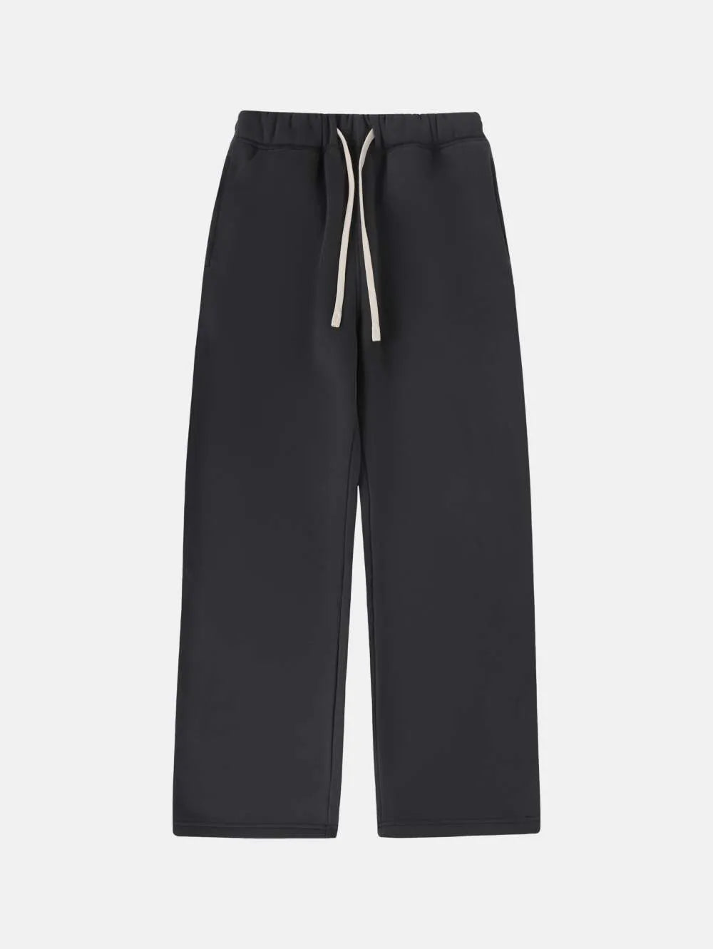 Man wearing black fleece-lined loose-fit sweatpants with an elastic drawstring waist