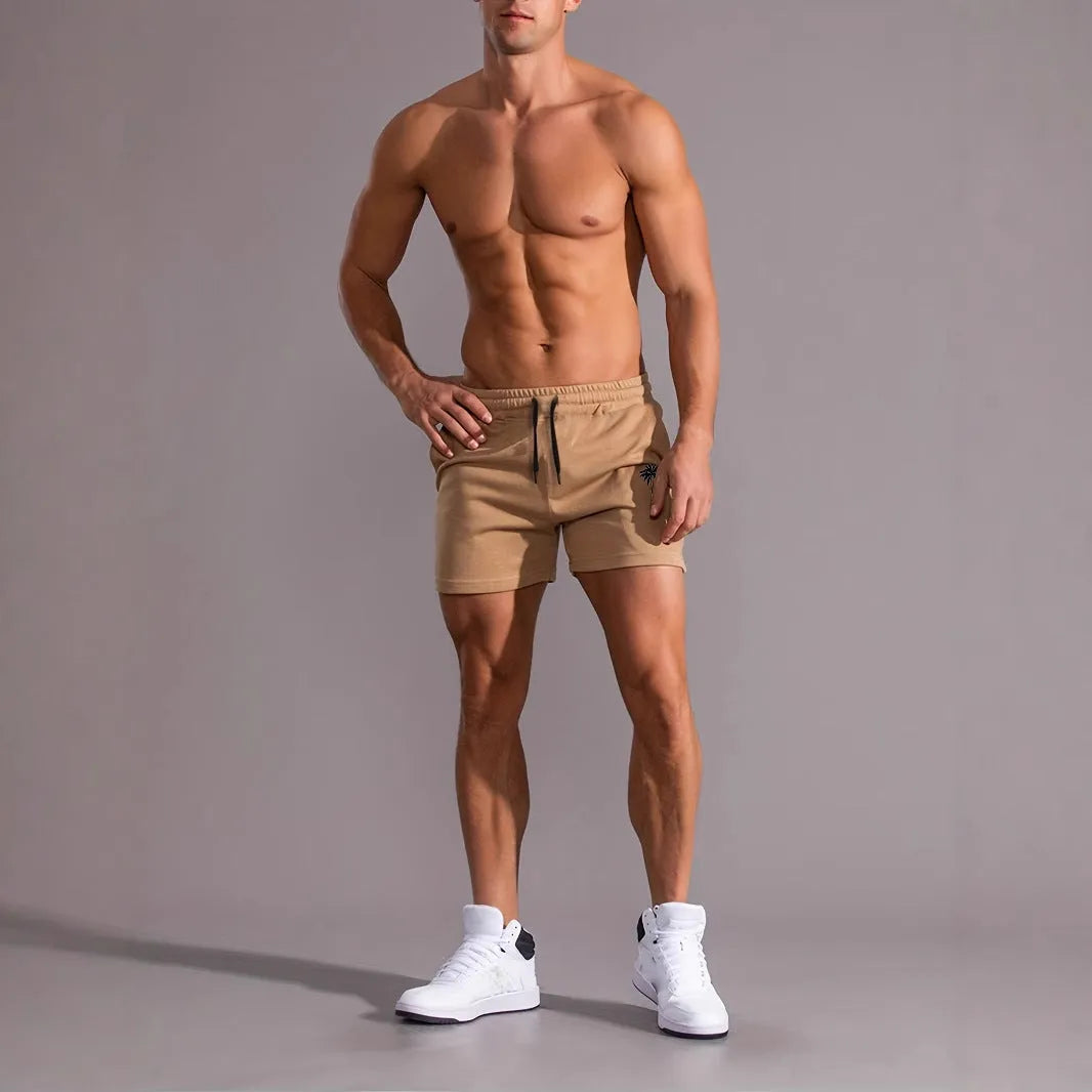 Man wearing khaki coconut print polyester sports shorts
