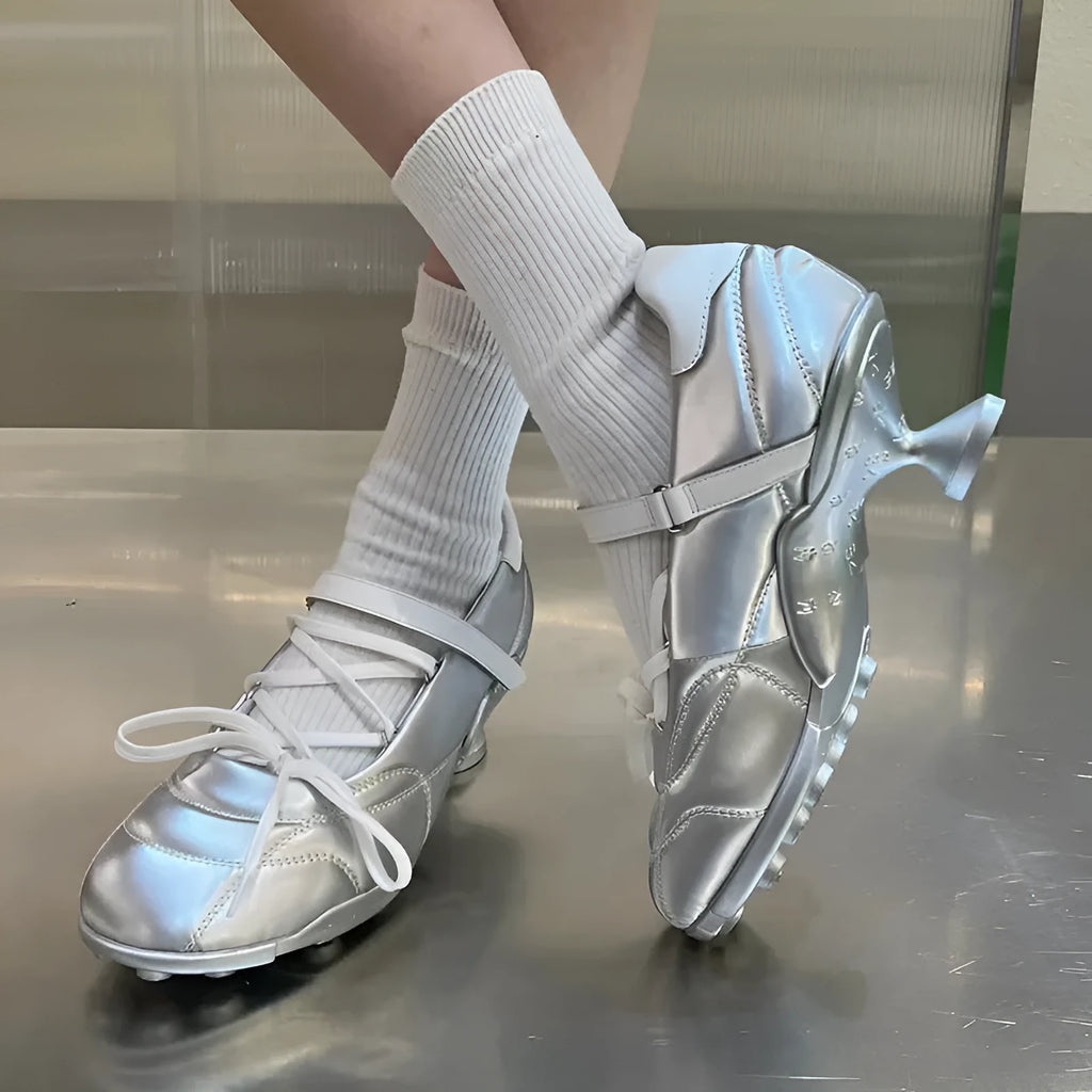 Women's silver low-top sports shoes with front lace-up and bow detail on a round toe.
