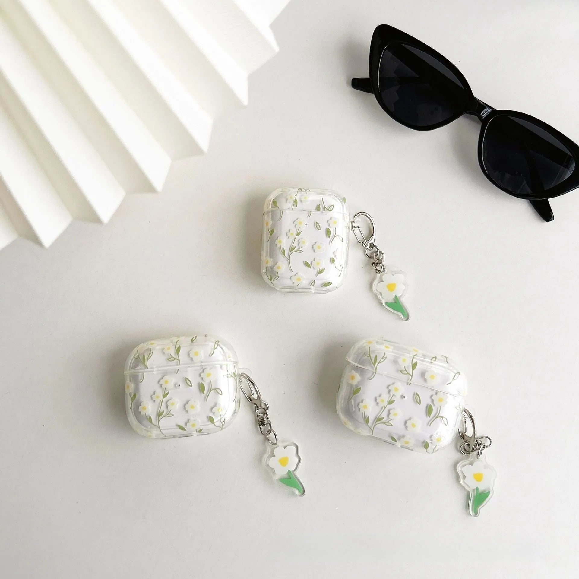 White floral transparent TPU protective case for Apple AirPods charging case.