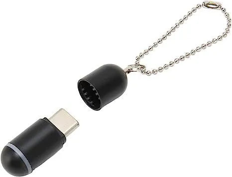 Black universal infrared remote control emitter capsule for smartphone Lightning, Type-C, and Micro USB ports.