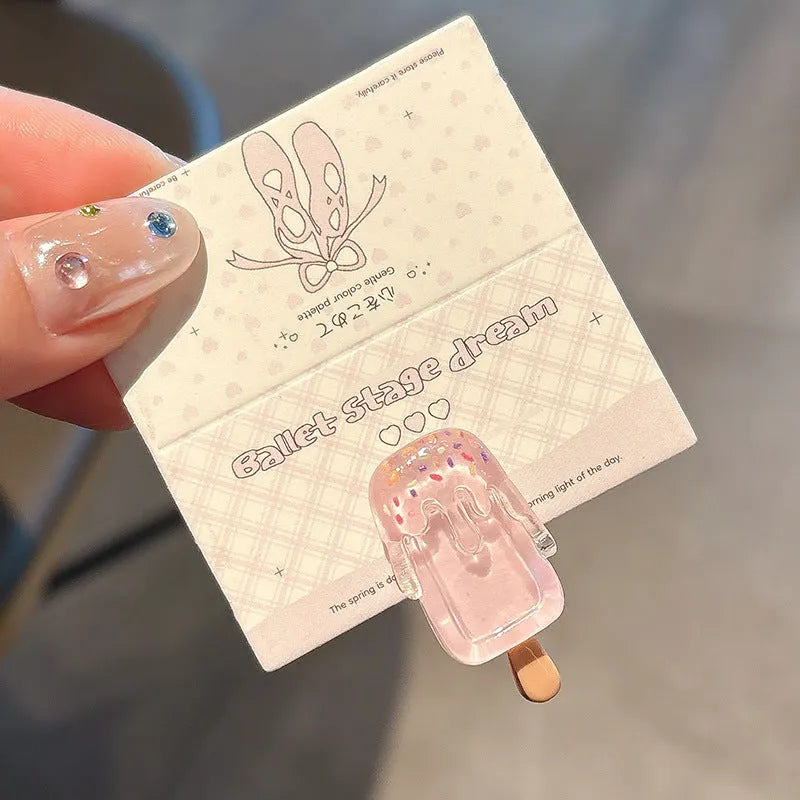 Resin hair barrette featuring a cartoon ice cream design in pink, red, coffee, purple, and beige colour options.
