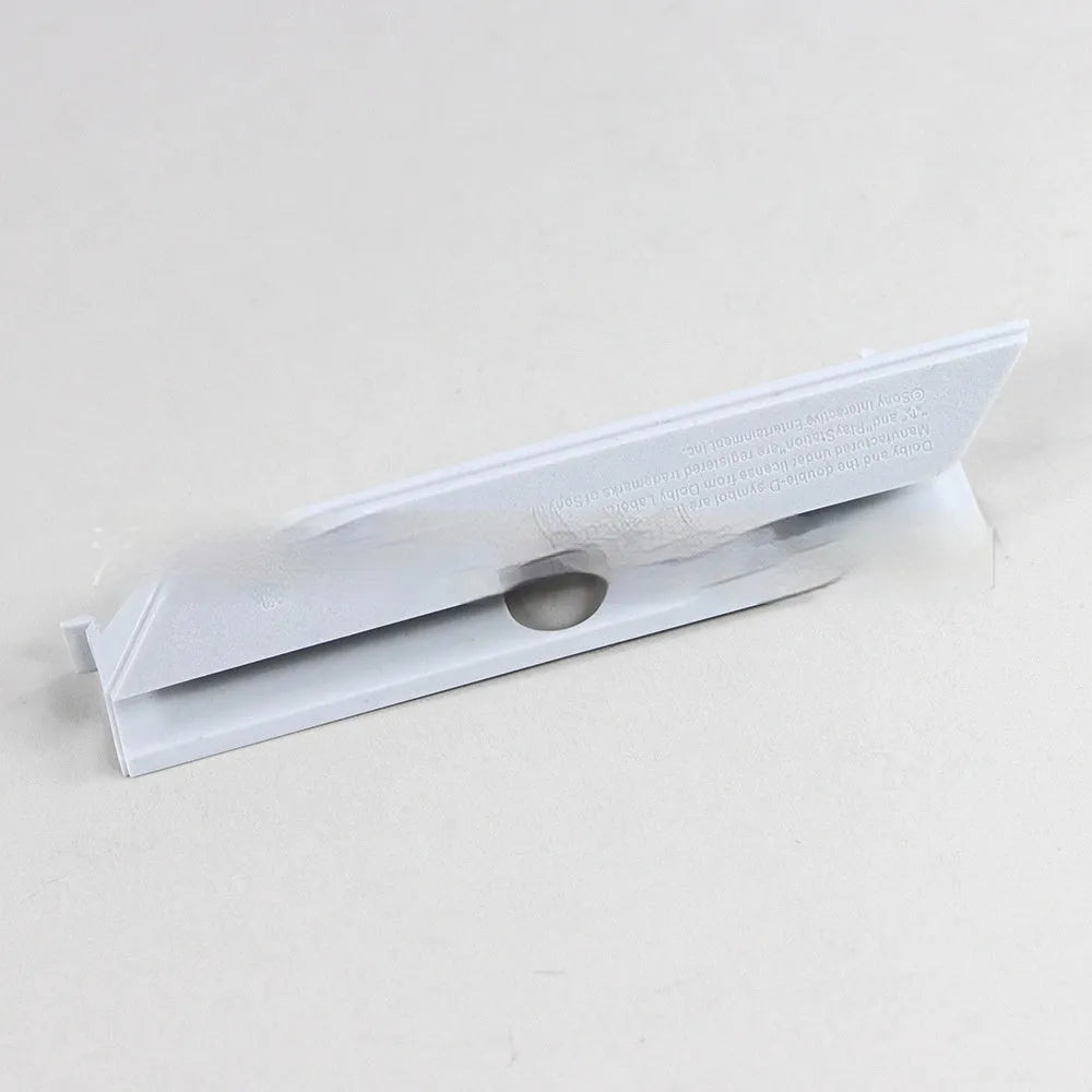 Black and white plastic 3.5-inch hard drive bay cover for PC cases.