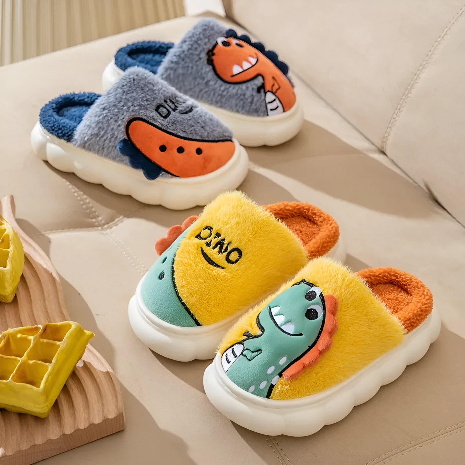 Plush cotton couple slippers in dinosaur design, available in grey, coffee and orange, showing thickened sole.