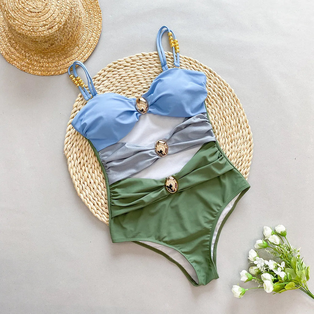 Women's brown one-piece swimsuit with matching beige skirt cover-up on size mannequin