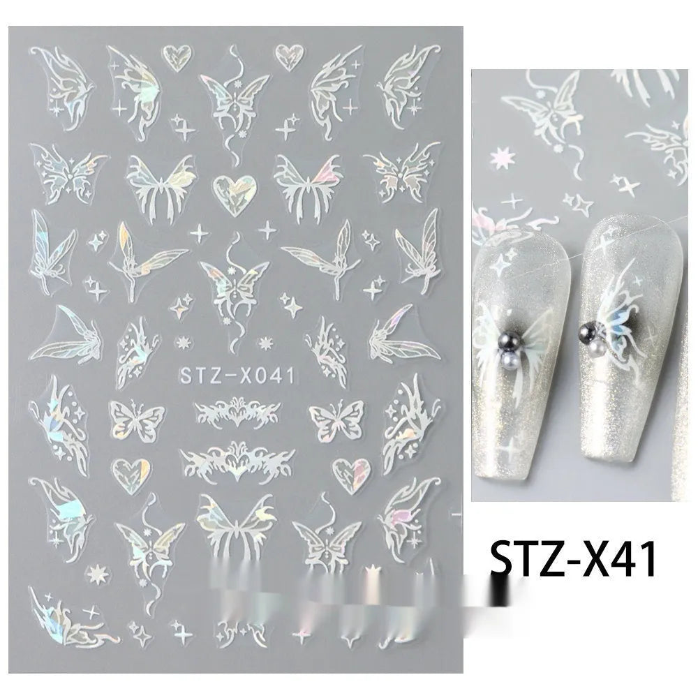 Close-up of a cartoon-style nail sticker with black and silver strips and a love pattern design on a fingernail.