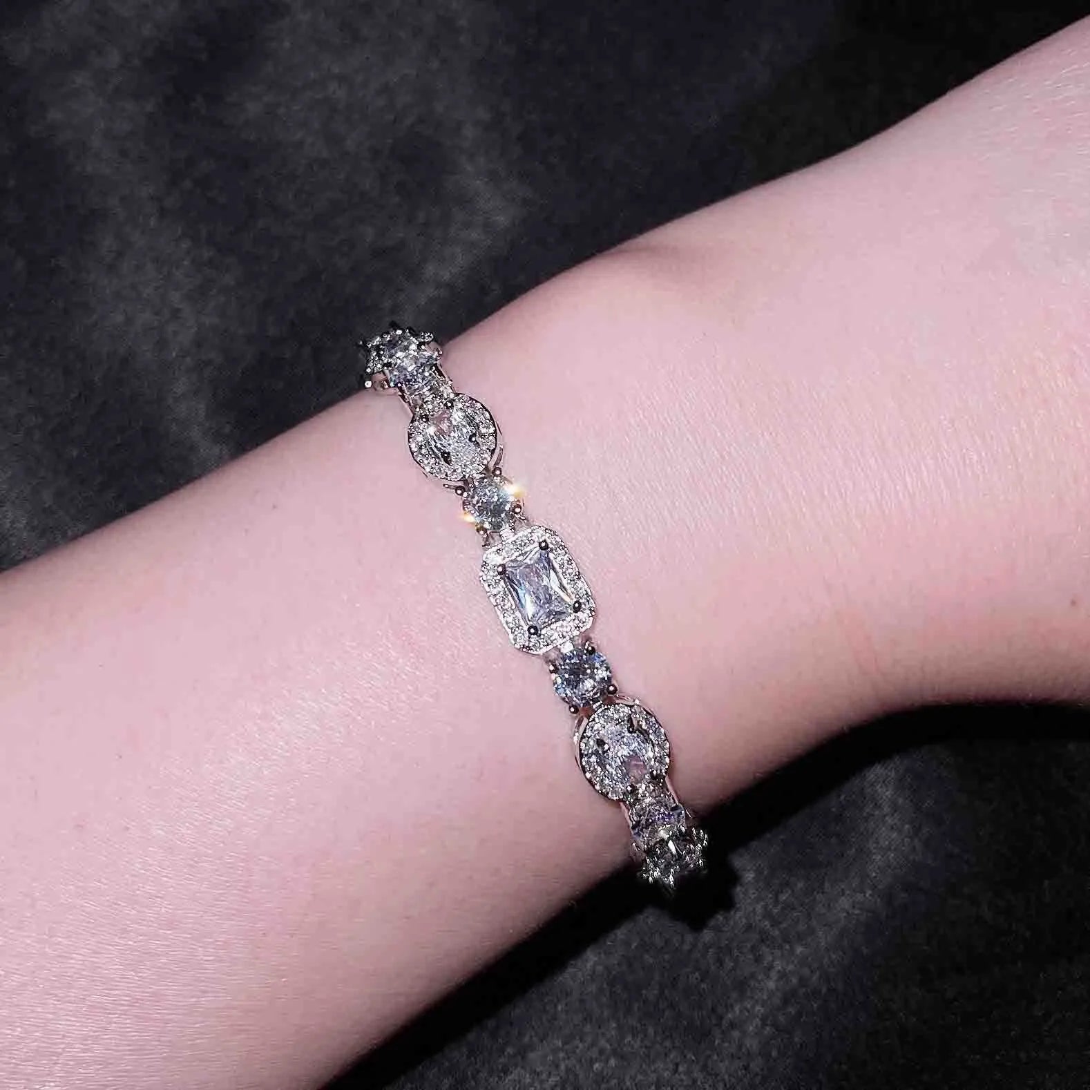 Women's white gold plated geometric bracelet with zircon stones in two length options.