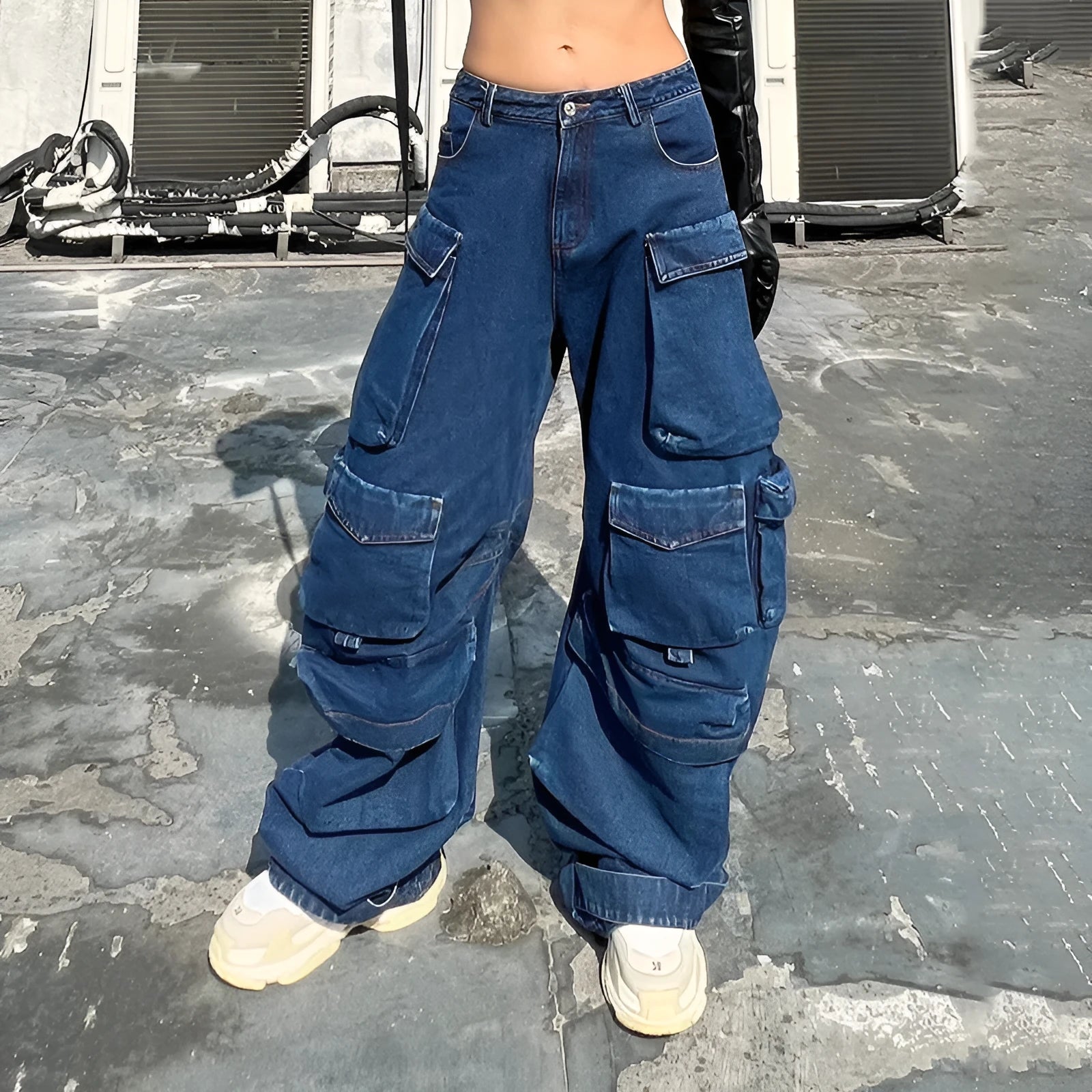 Dark blue women's distressed wide-leg jeans with a high waist and multiple utility pockets.
