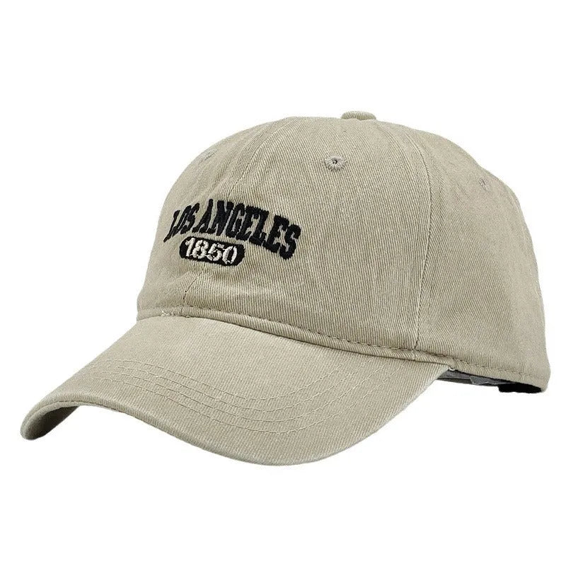 Personalised embroidered retro-style peaked cap in distressed beige with adjustable strap