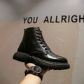 Men's black platform ankle boots with 8-eye lacing and a side zipper on a rubber sole.