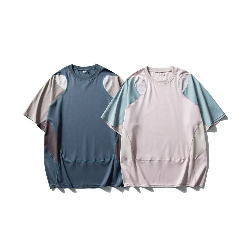 Men's loose fit blue patchwork sports T-shirt with raglan short sleeves on a hanger.